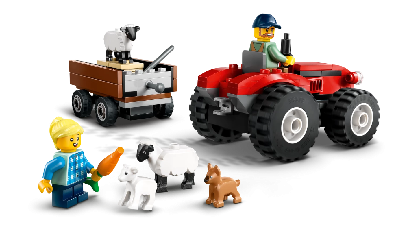 Rode tractor met aanhanger en schapen