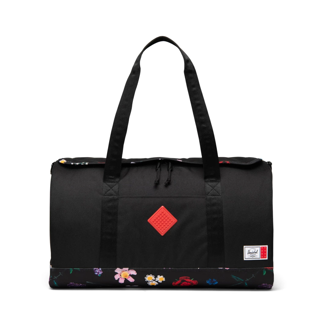 Herschel Heritage weekendtas - zwart met dwarrelende bloemen